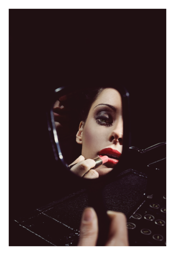 After Hours fine art photograph by LiAns JadAn featuring a woman applying red lipstick while reflected in a compact mirror