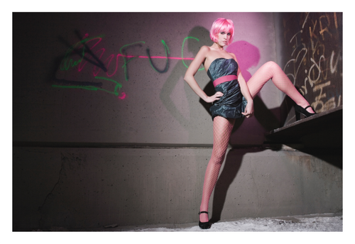 Electric Pink fine art fashion photograph by LiAns JadAn featuring a model with a vivid pink wig against graffiti-covered concrete
