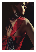 Final Notice fine art photograph by LiAns JadAn featuring a woman in a red dress concealing a revolver behind her back in dramatic noir lighting