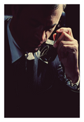 Private Line fine art photograph by LiAns JadAn featuring a suited man speaking privately on a telephone in dramatic low light